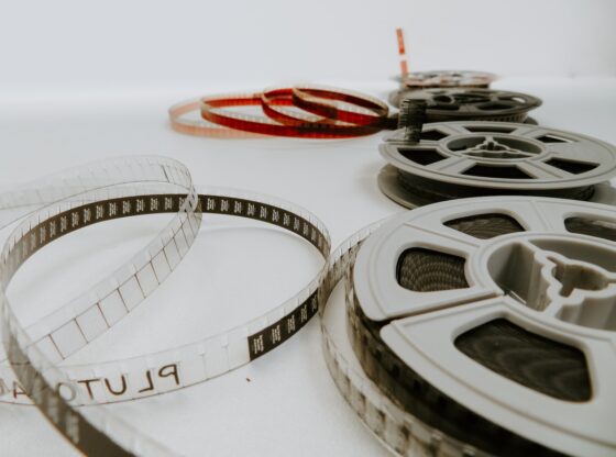 four reel films lying on white table